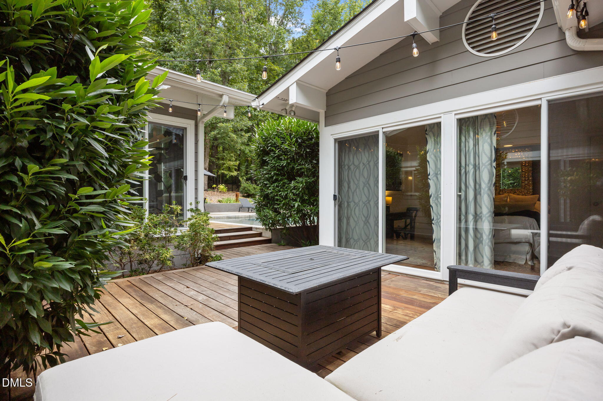 1812 Rolling Road Chapel Hill, NC 27514 - Photo 27 of 72 a wooden bench sitting in front of a building