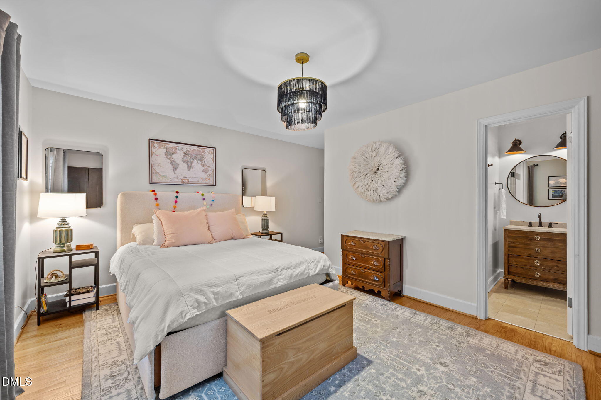 1812 Rolling Road Chapel Hill, NC 27514 - Photo 28 of 72 a bedroom with bed and a chandelier