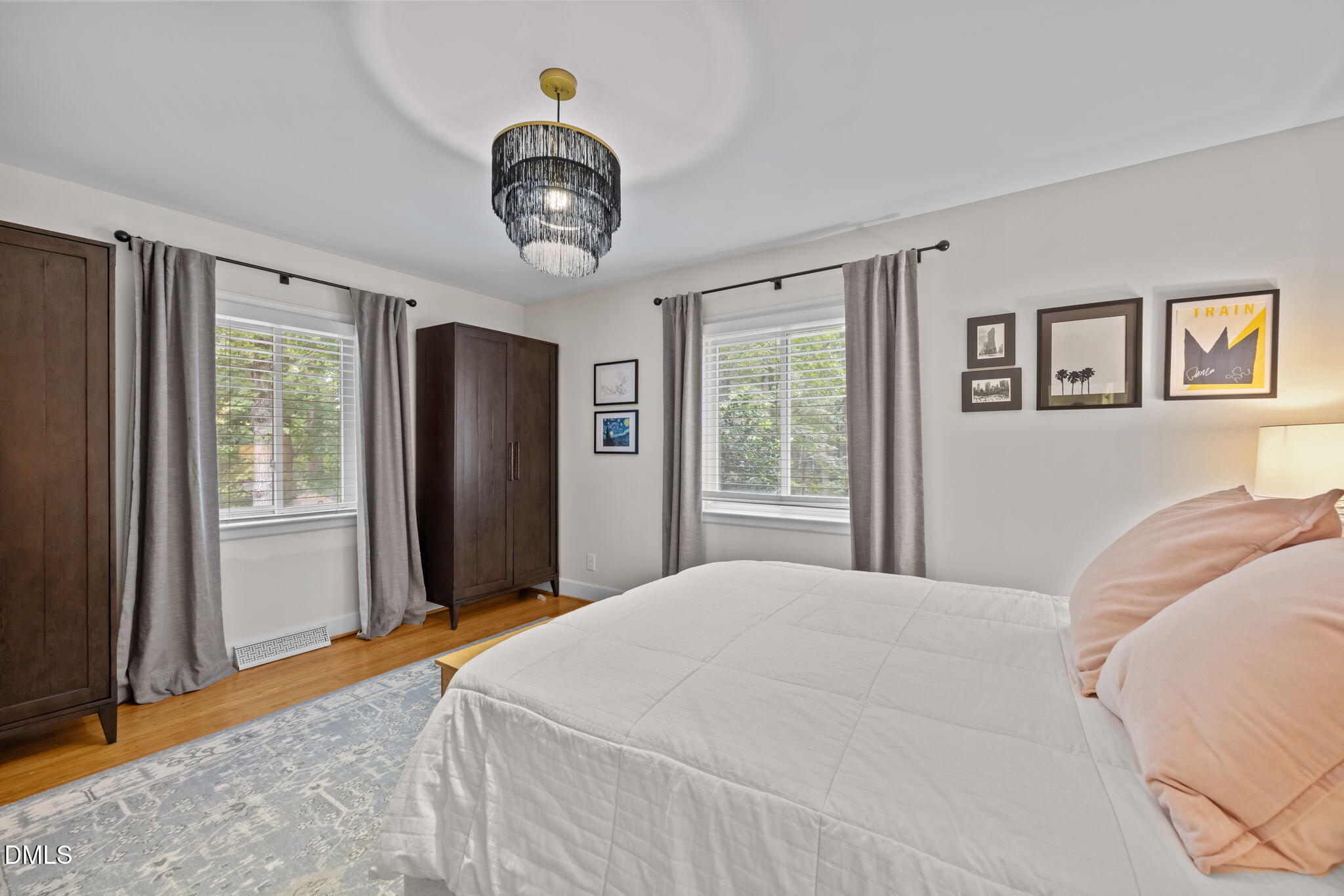 1812 Rolling Road Chapel Hill, NC 27514 - Photo 31 of 72 a bedroom with a large bed and a window