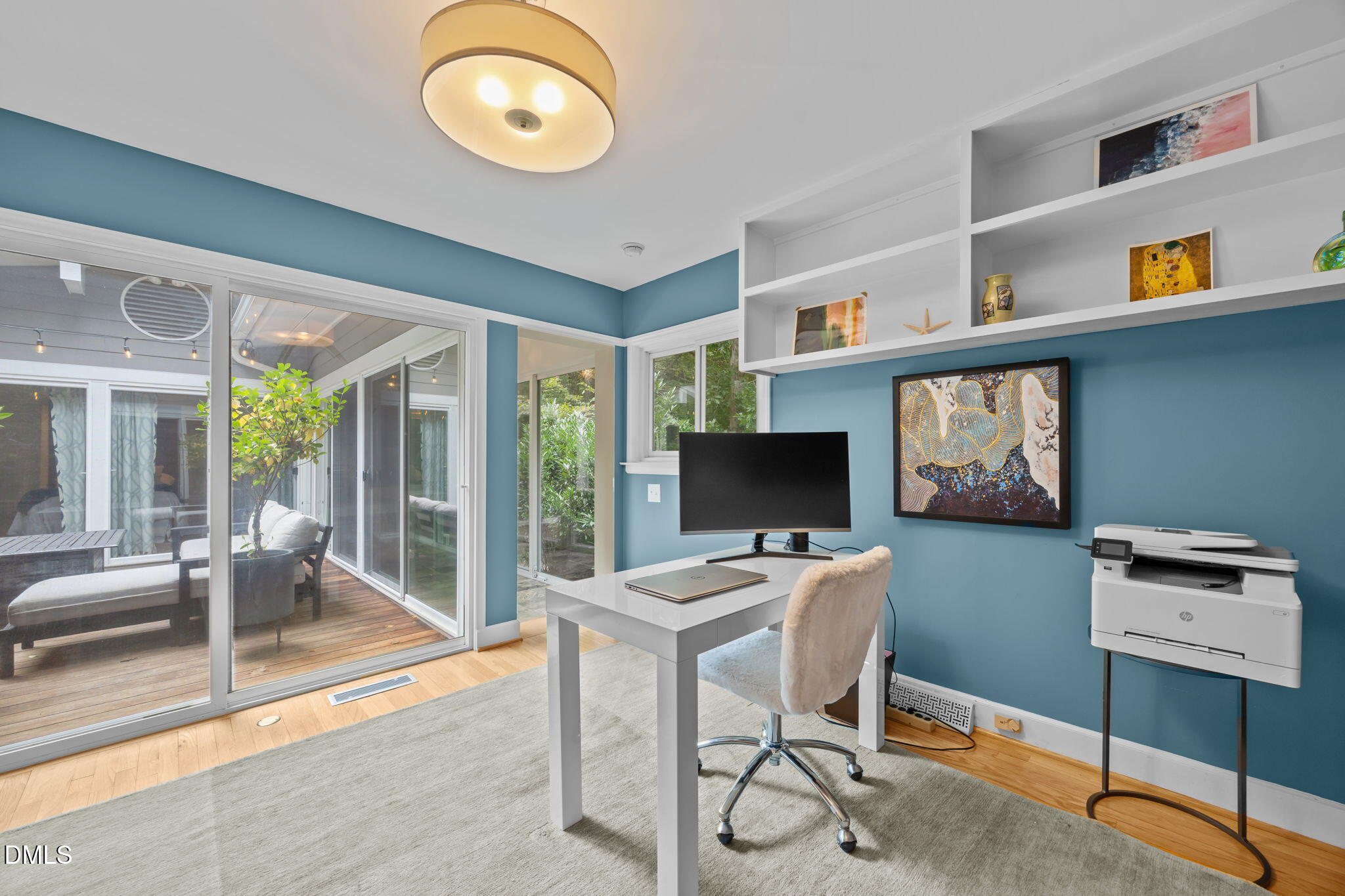 1812 Rolling Road Chapel Hill, NC 27514 - Photo 35 of 72 a work room with furniture and a floor to ceiling window
