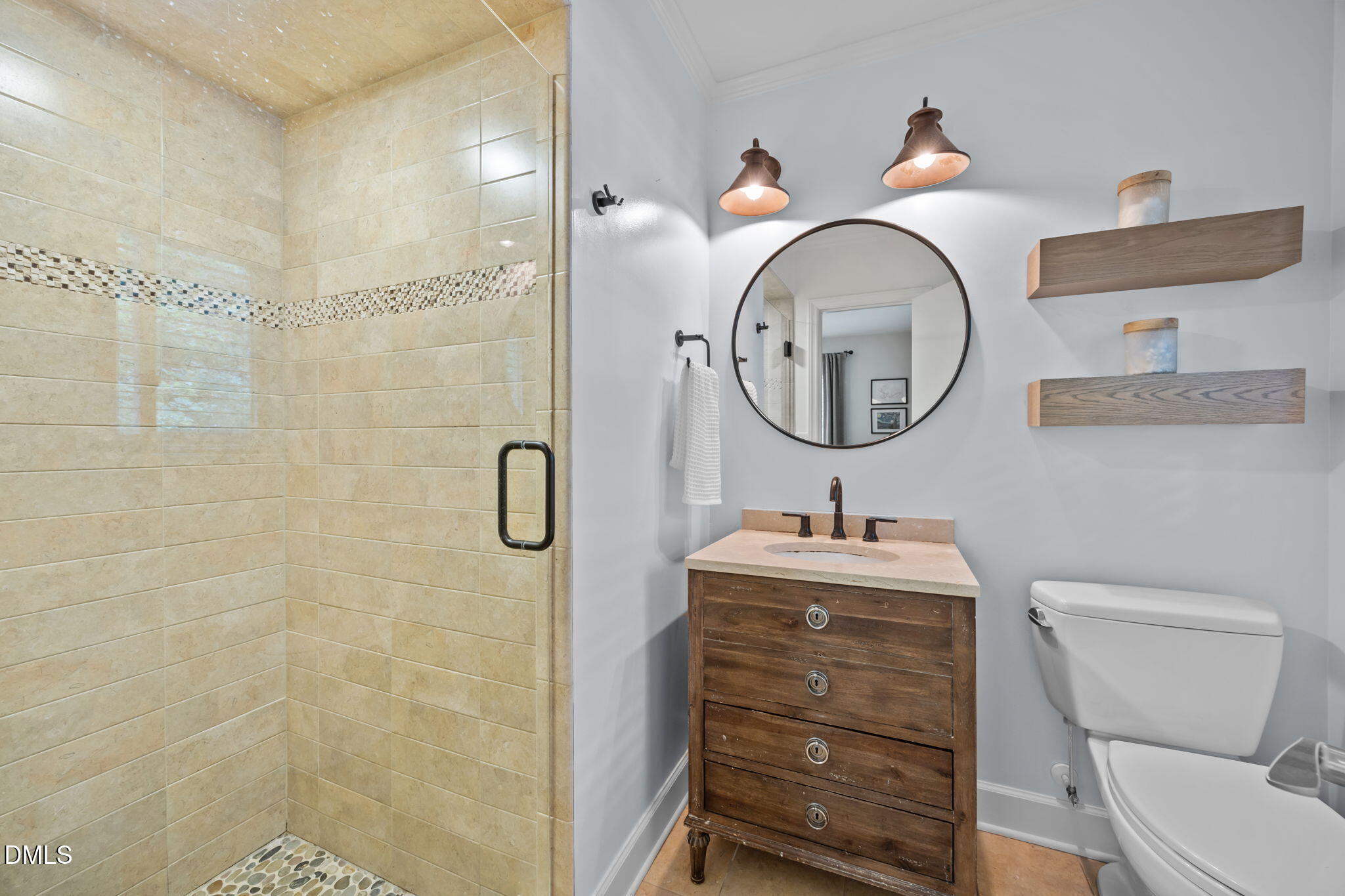 1812 Rolling Road Chapel Hill, NC 27514 - Photo 38 of 72 a bathroom with a sink a toilet and a mirror