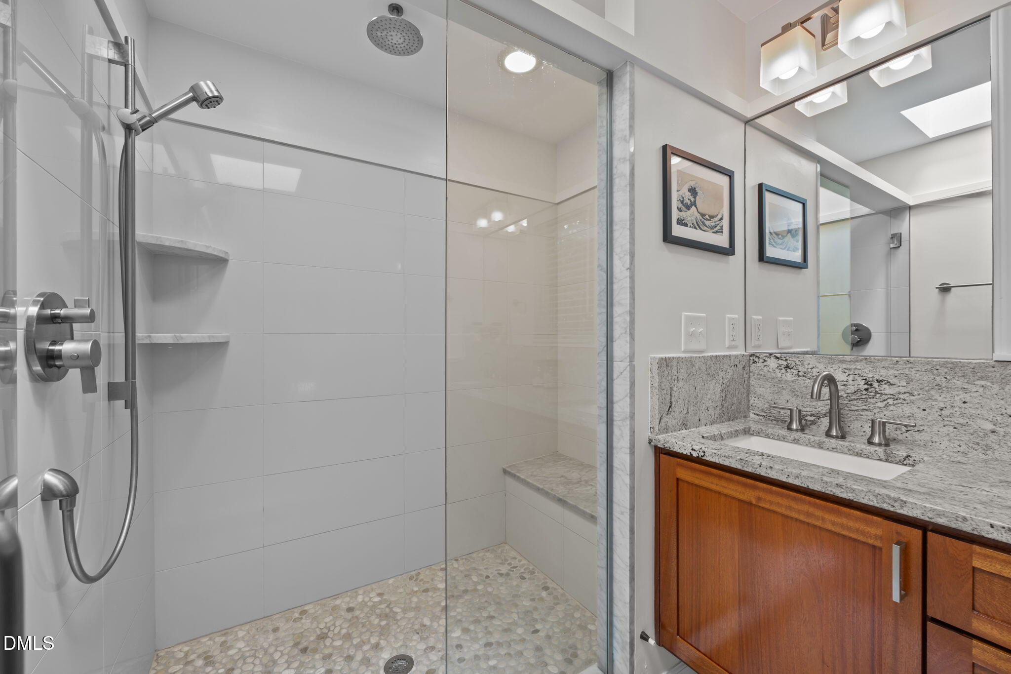 1812 Rolling Road Chapel Hill, NC 27514 - Photo 39 of 72 a bathroom with a granite countertop sink a mirror and shower