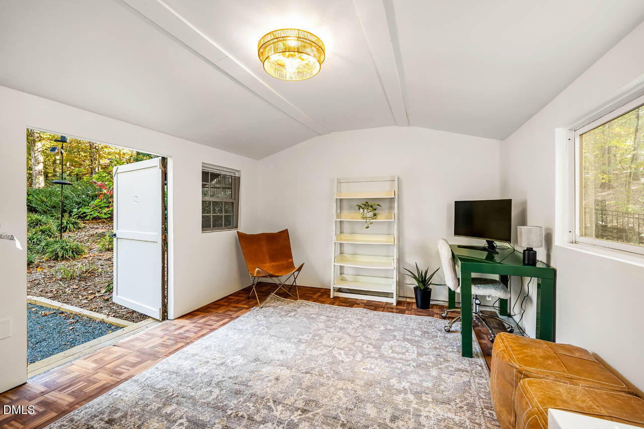 1812 Rolling Road Chapel Hill, NC 27514 - Photo 45 of 72 a living room with furniture and a flat screen tv