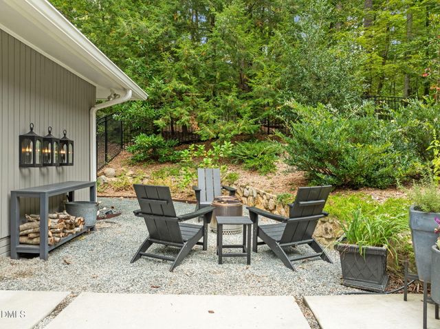 an aerial view of a house with yard and outdoor seating