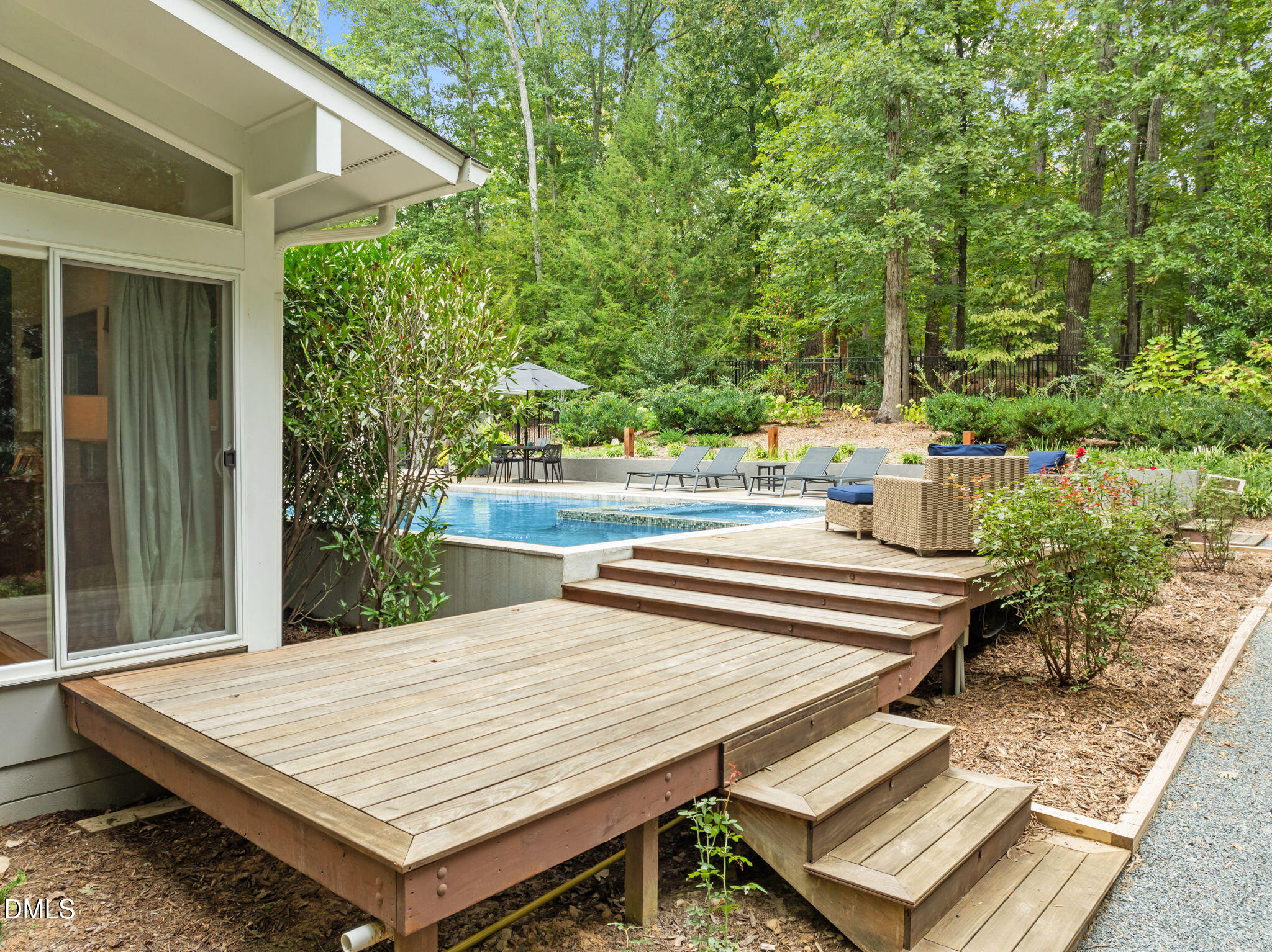 1812 Rolling Road Chapel Hill, NC 27514 - Photo 49 of 72 a view of a patio with table and chairs and potted plants