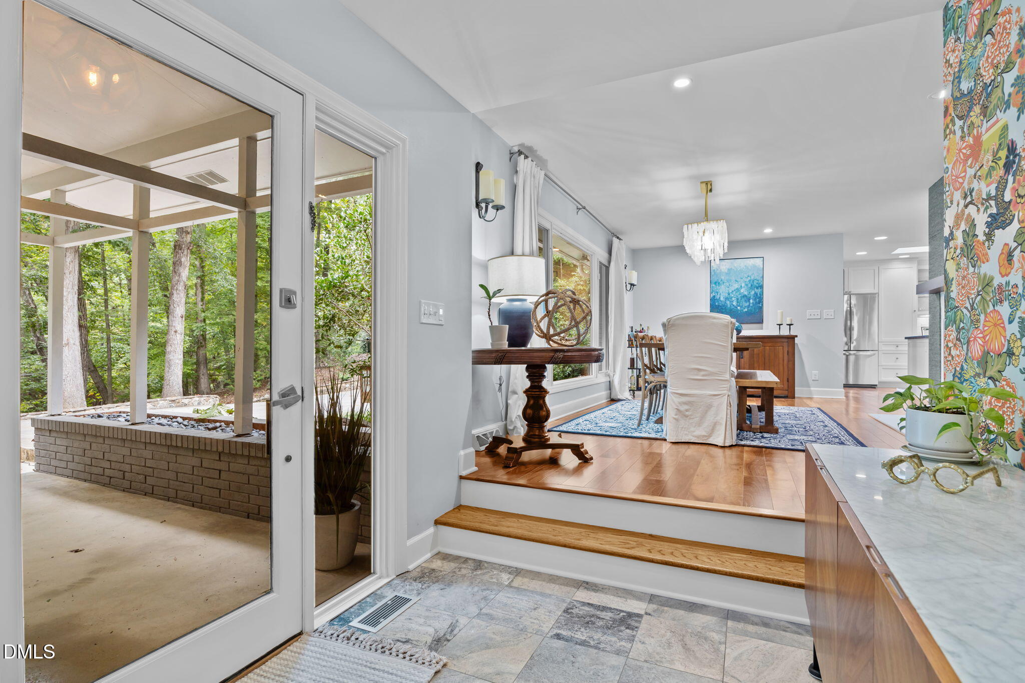 1812 Rolling Road Chapel Hill, NC 27514 - Photo 7 of 72 a view of a living room and kitchen floor to ceiling window or room
