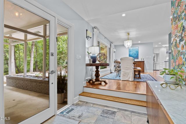 a view of a living room and kitchen floor to ceiling window or room
