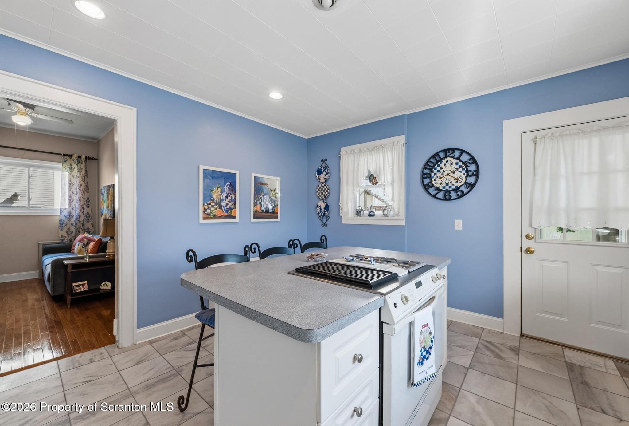 616 Myrtle Street Scranton, PA 18510 - Photo 17 of 65 a kitchen with a stove and a table