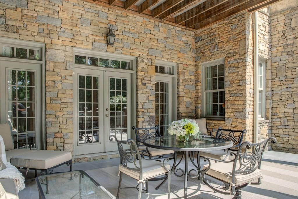 1005 Heards Ferry Road Northwest Sandy Springs, GA 30328 - Photo 29 of 30 a view of a patio with table and chairs and potted plants
