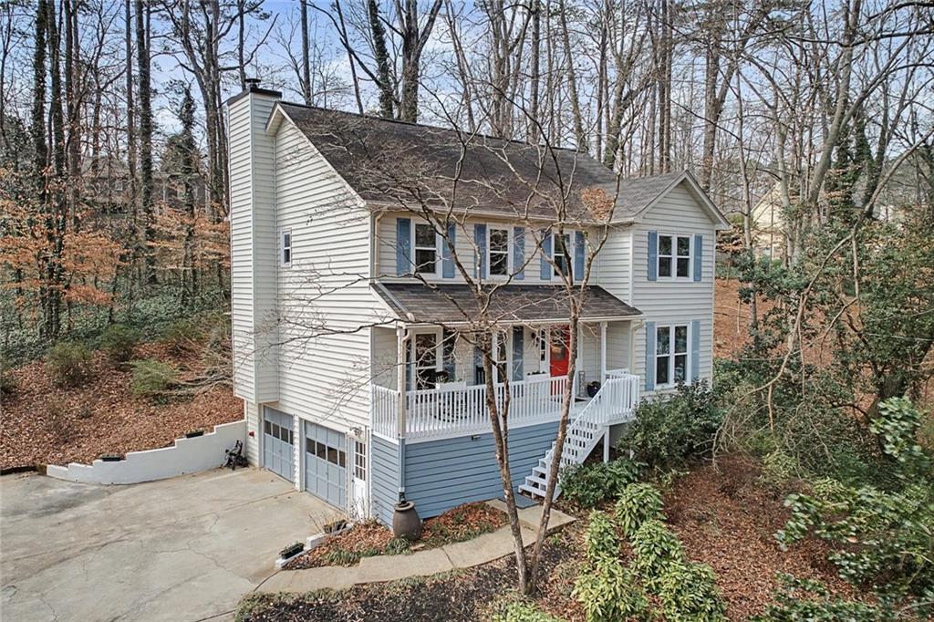507 Spring Creek Way Northeast Marietta, GA 30068 - Photo 1 of 50 a view of a house with a yard and roof deck
