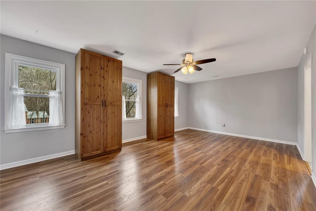 507 Spring Creek Way Northeast Marietta, GA 30068 - Photo 22 of 50 wooden floor in an empty room with a window