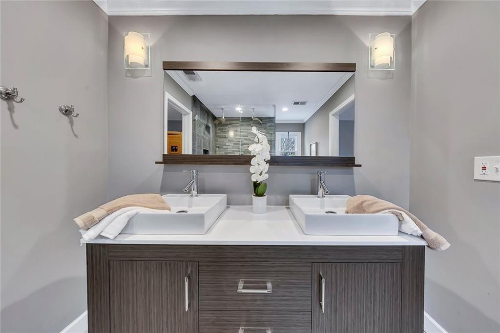 507 Spring Creek Way Northeast Marietta, GA 30068 - Photo 26 of 50 a bathroom with a sink and a mirror