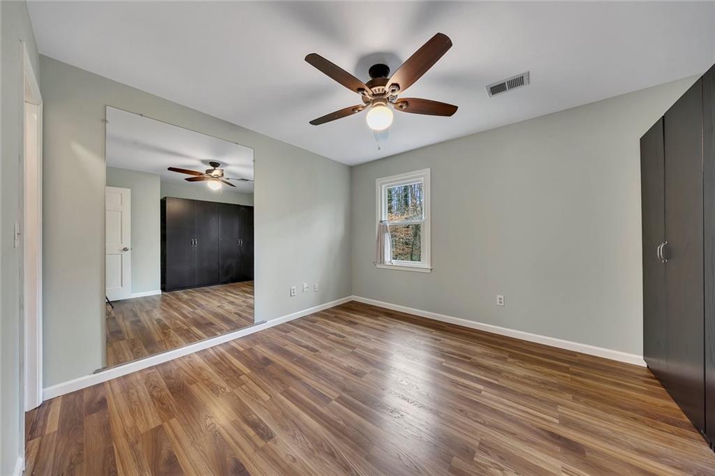 507 Spring Creek Way Northeast Marietta, GA 30068 - Photo 29 of 50 a view of hallway with wooden floor and ceiling fan