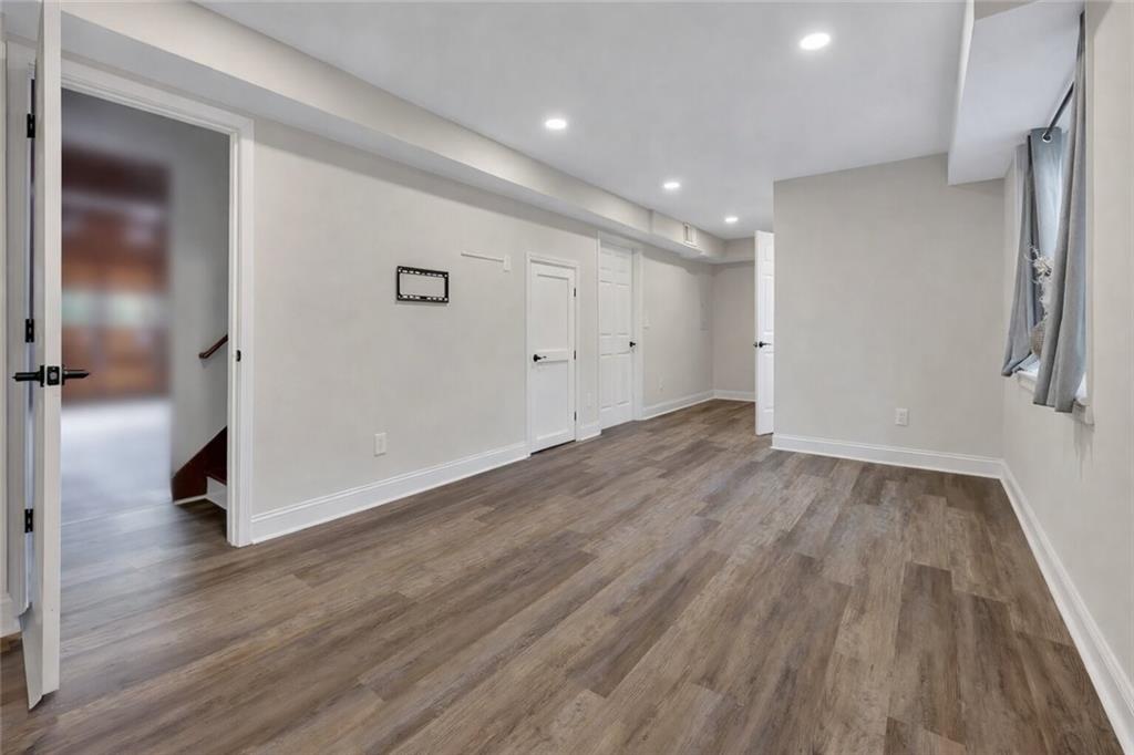 507 Spring Creek Way Northeast Marietta, GA 30068 - Photo 33 of 50 wooden floor in an empty room with a window