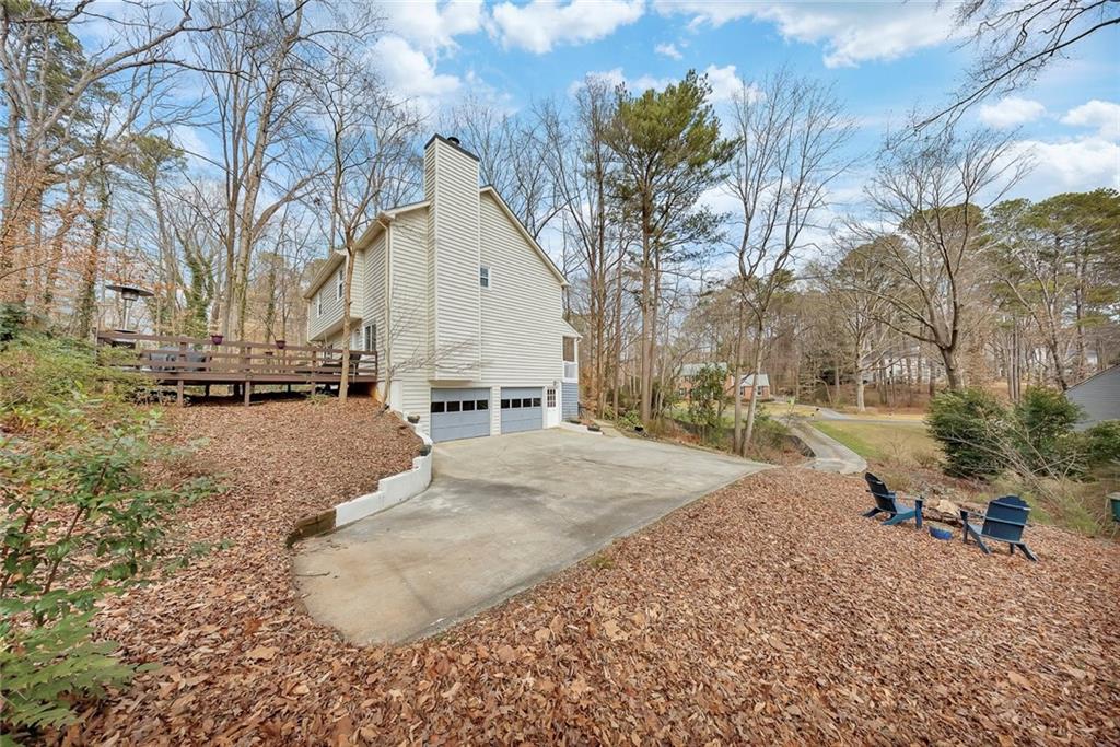 507 Spring Creek Way Northeast Marietta, GA 30068 - Photo 42 of 50 a view of a yard with a house