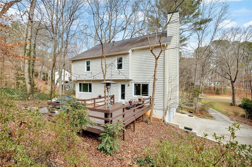 507 Spring Creek Way Northeast Marietta, GA 30068 - Photo 43 of 50 a backyard of a house with table and chairs