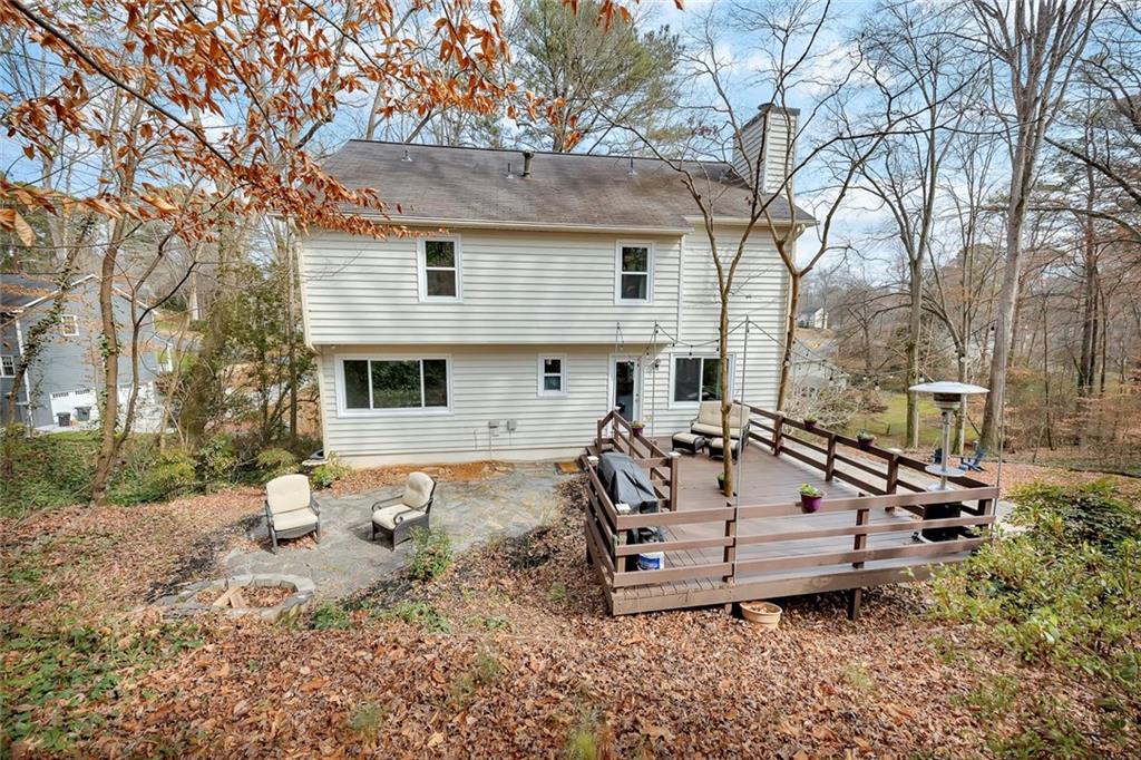 507 Spring Creek Way Northeast Marietta, GA 30068 - Photo 44 of 50 a view of a house with backyard and sitting area