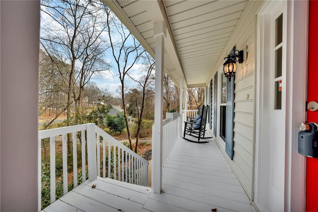 507 Spring Creek Way Northeast Marietta, GA 30068 - Photo 5 of 50 a view of a porch with wooden floor and stairs