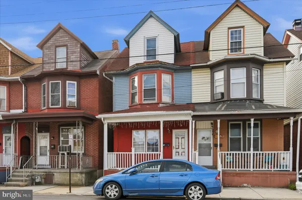 a car parked in front of a house