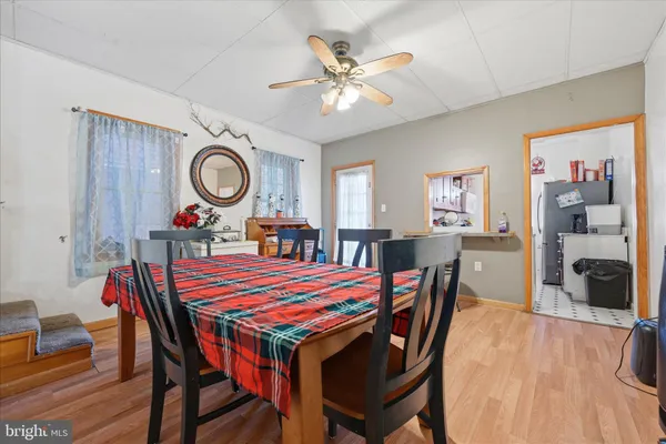 a dining room with furniture and window