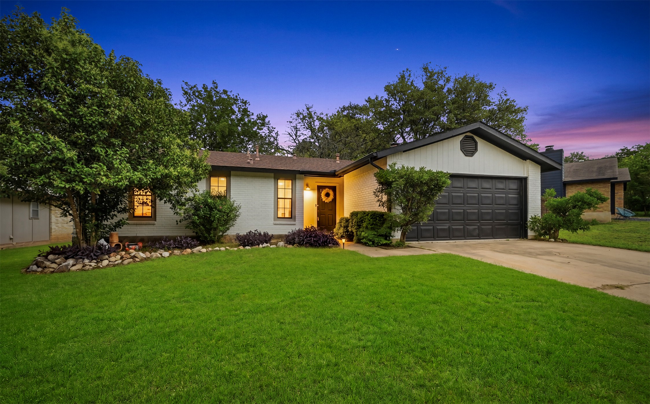 6805 Rearden Road Austin, TX 78745 - Photo 1 of 26 Welcome to 6805 Rearden Rd - a tranquil retreat in desirable Southwest Austin. Grass has been artificially greened to show seasonality.
