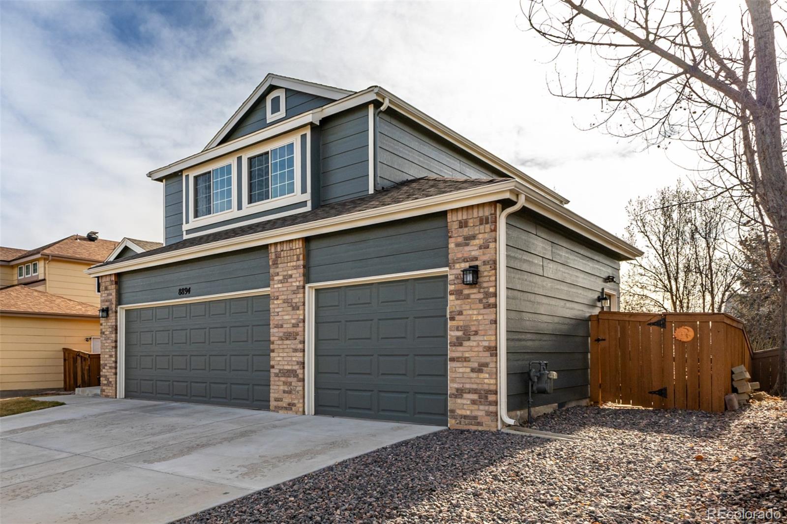 8894 Miners Street Highlands Ranch, CO 80126 - Photo 2 of 41 a front view of a house with a yard