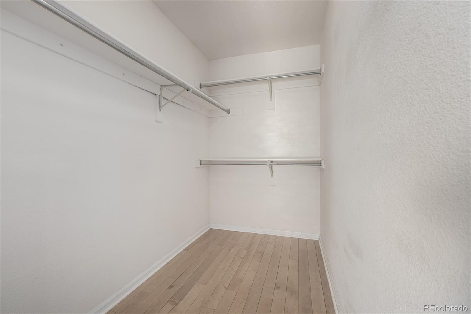 8894 Miners Street Highlands Ranch, CO 80126 - Photo 26 of 41 a view of a room with wooden floor