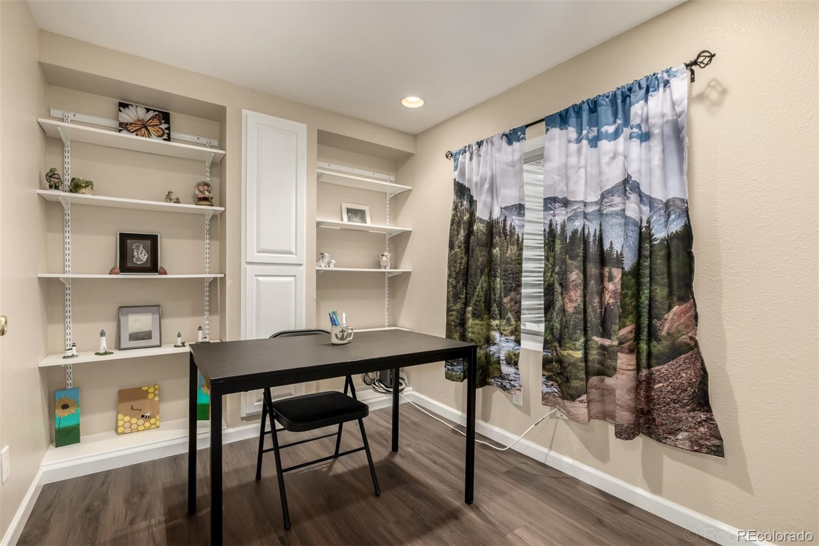 8894 Miners Street Highlands Ranch, CO 80126 - Photo 27 of 41 a view of a workspace with furniture and wooden floor