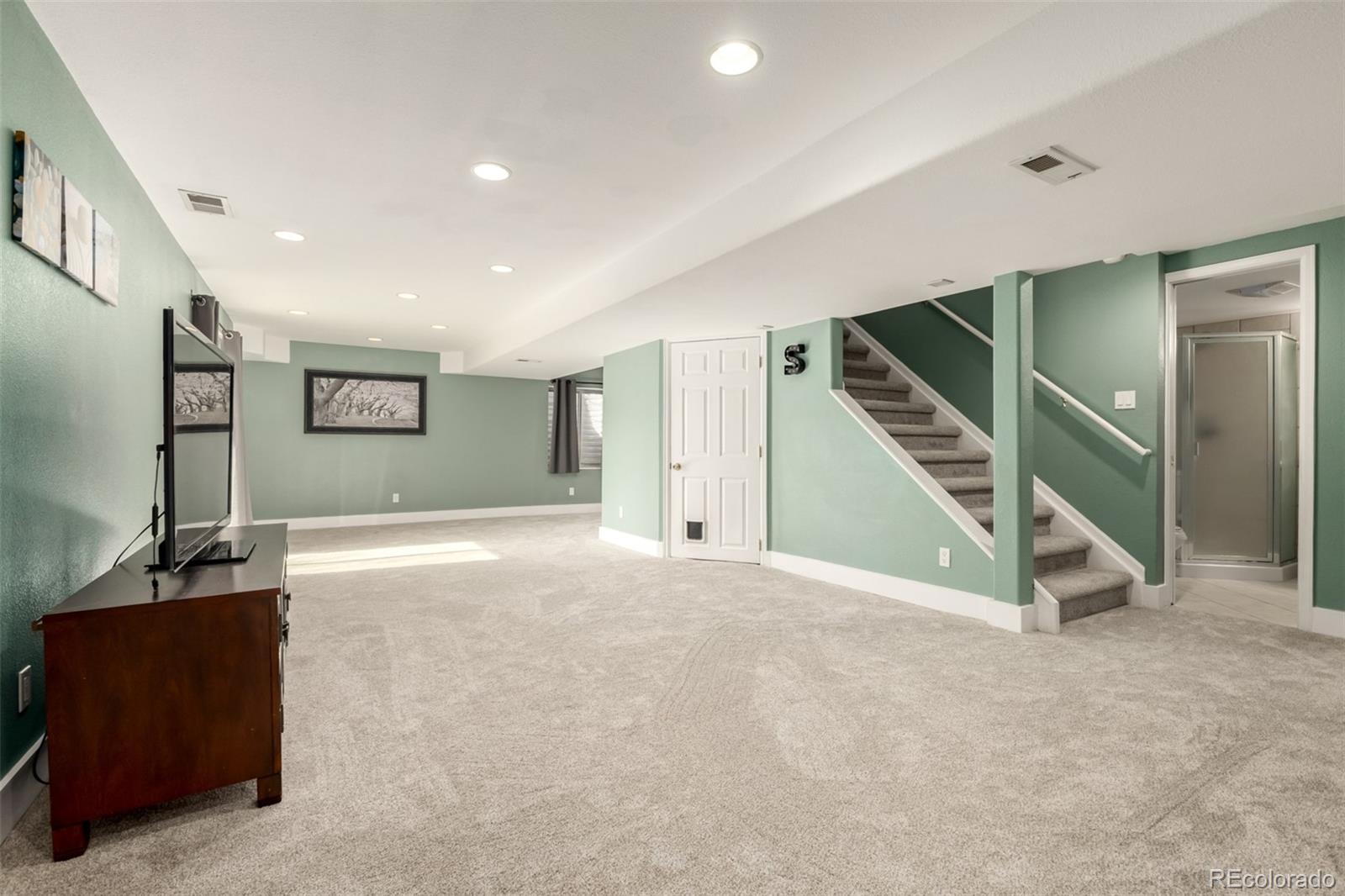 8894 Miners Street Highlands Ranch, CO 80126 - Photo 28 of 41 a view of an empty room with stairs