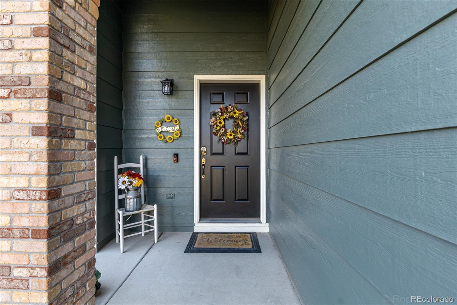 8894 Miners Street Highlands Ranch, CO 80126 - Photo 3 of 41 a front view of a house with glass door