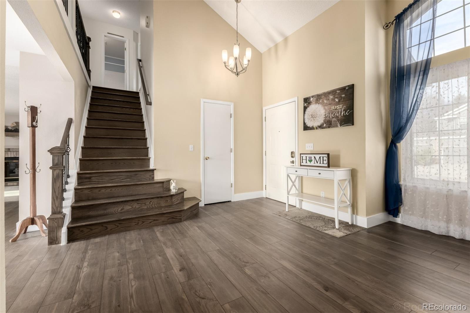 8894 Miners Street Highlands Ranch, CO 80126 - Photo 5 of 41 a view of entryway with wooden floor