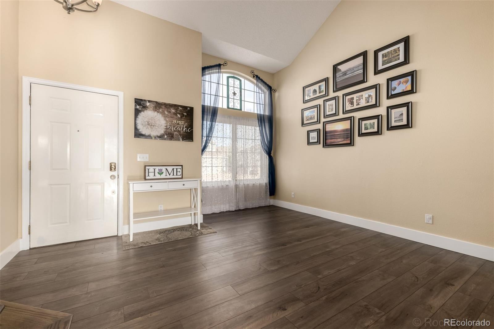 8894 Miners Street Highlands Ranch, CO 80126 - Photo 6 of 41 an empty room with windows and cabinet