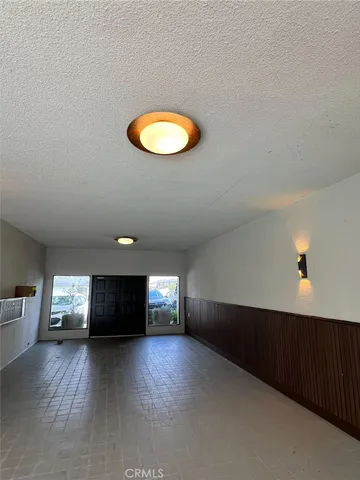 a view of a livingroom with furniture and window
