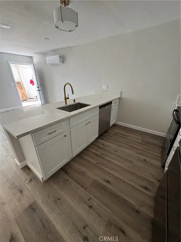 a spacious bathroom with a double vanity sink and a mirror