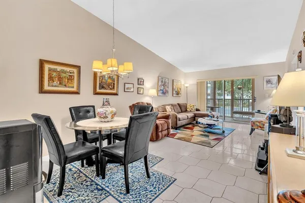 a dining room with furniture and window