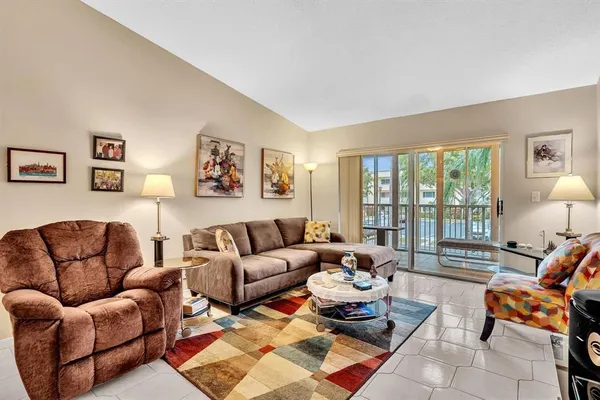 a living room with furniture and a large window