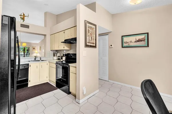 a view of a workspace with furniture and wooden floor