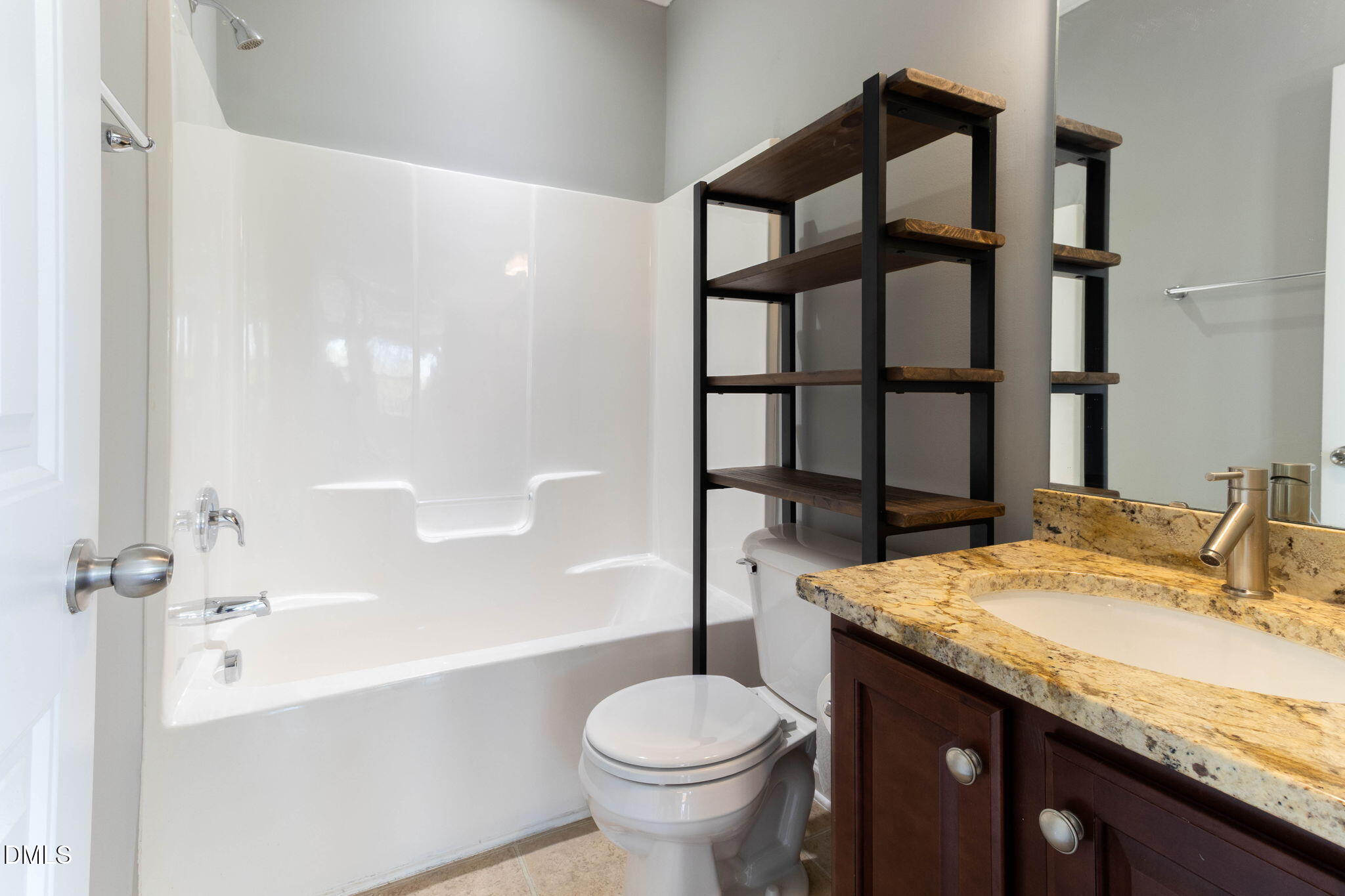 14303 Foxcroft Road Raleigh, NC 27614 - Photo 9 of 70 a bathroom with a granite countertop sink toilet and shower