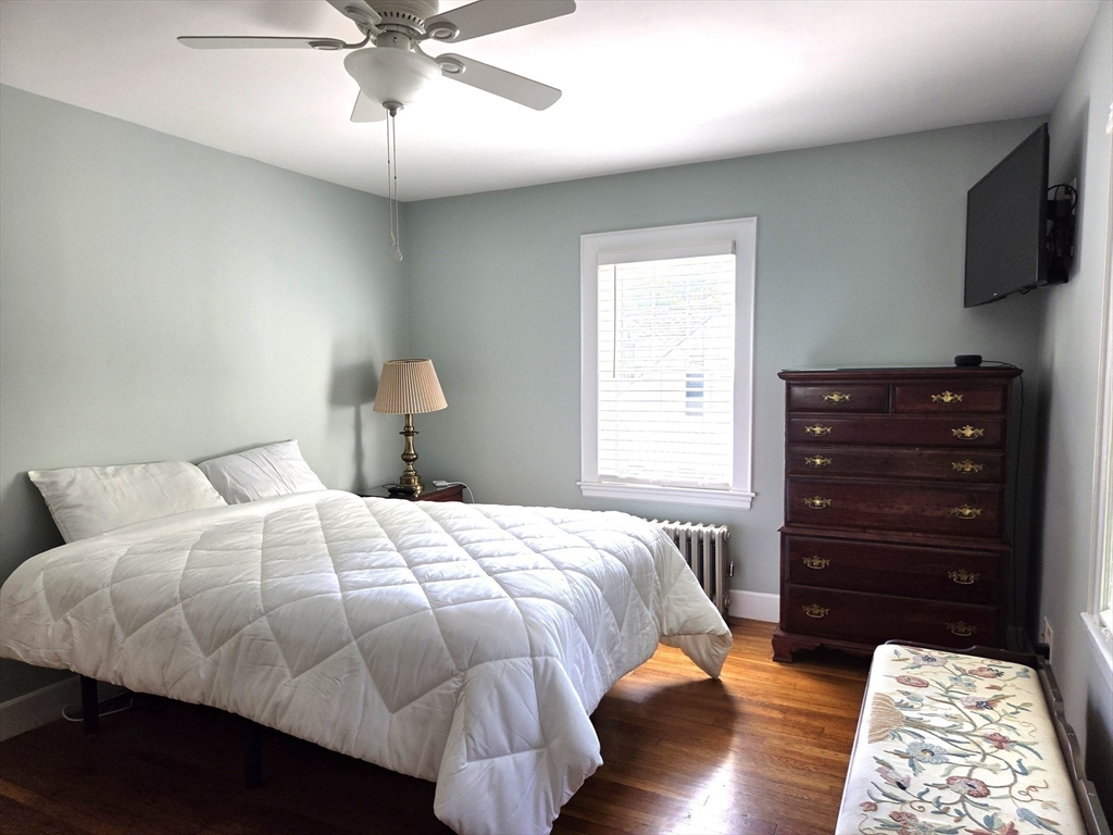25 Waldeck Road Milton, MA 02186 - Photo 19 of 34 a bedroom with a bed and a television