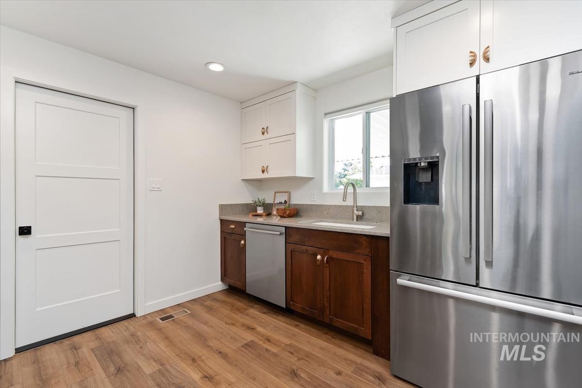 2217 North Middlefield Road Boise, ID 83704 - Photo 16 of 34 Stainless steel French door refrigerator with an integrated ice and water dispenser