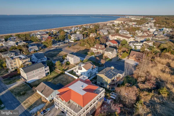 a bedroom with a bed and a chair