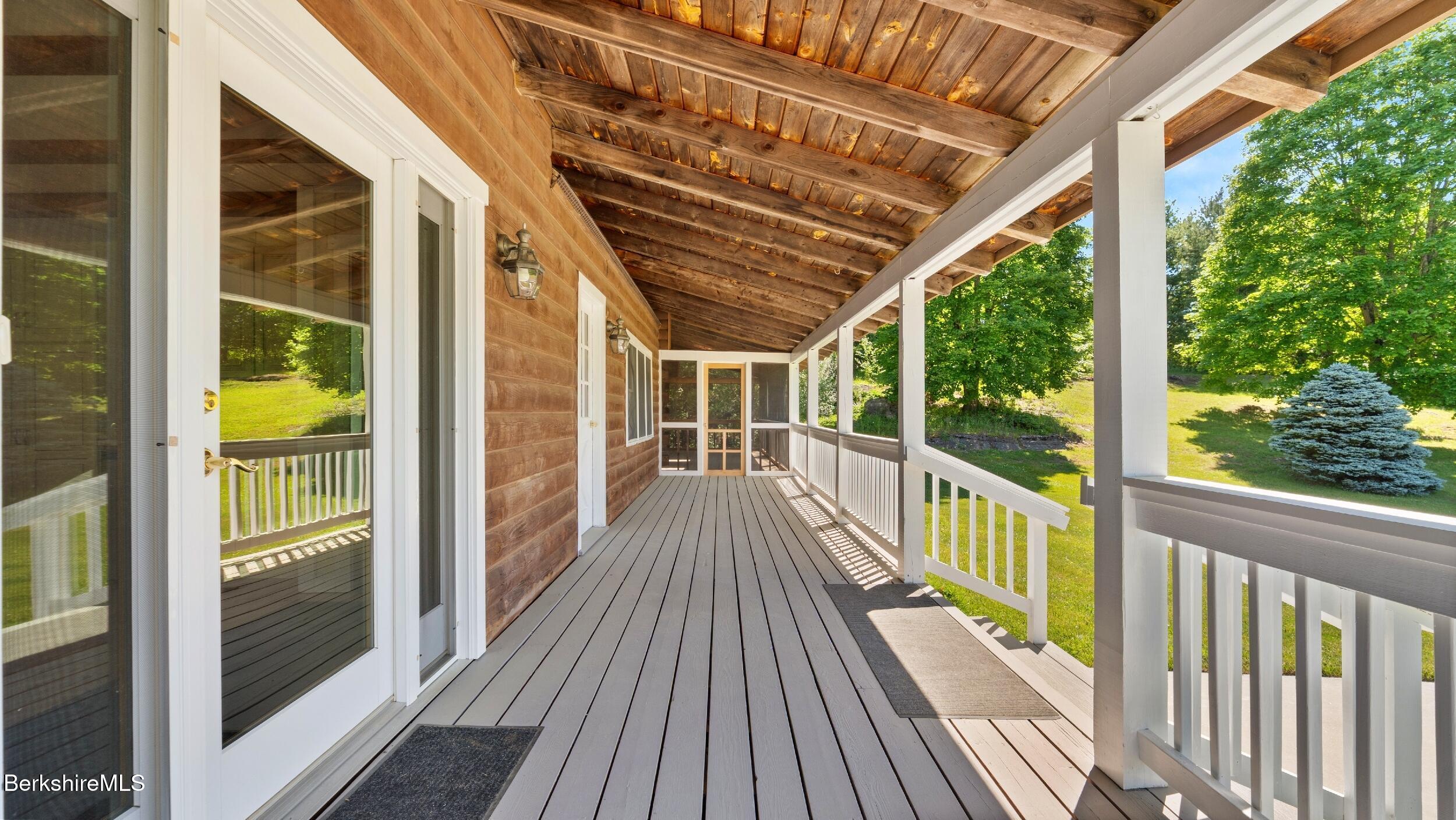 134 Hurlburt Road Great Barrington, MA 01230 - Photo 43 of 50 a view of a balcony with wooden floor