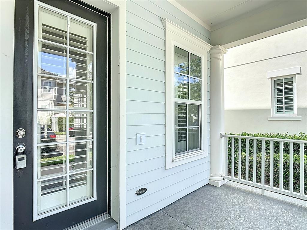 1513 Resolute Street Celebration, FL 34747 - Photo 7 of 43 a view of front door and porch