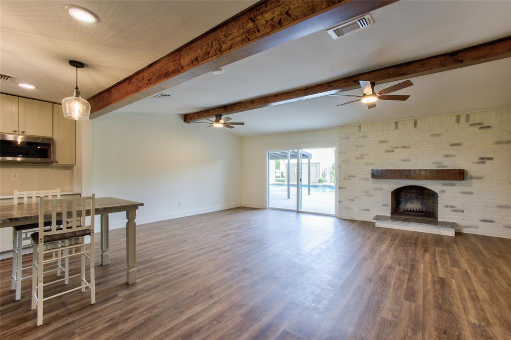 206 Americana Road Palmer, TX 75152 - Photo 7 of 40 View into the Living Room & Look at the Brick Wood Burning Fireplace
