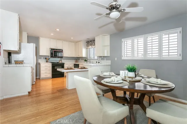 a view of kitchen with dining table and chairs