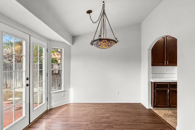 a bedroom with a large bed and a window