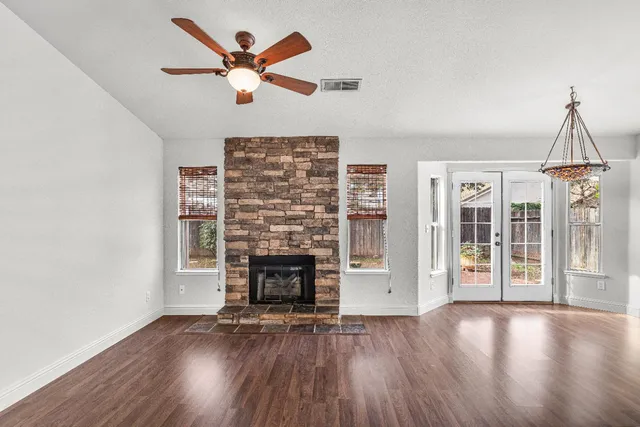 a bedroom with bed and a window