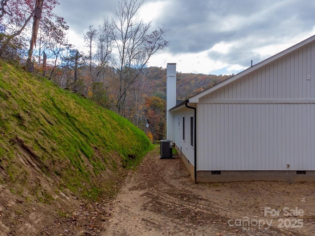 679 Firefly Road Whittier, NC 28789 - Photo 33 of 34 a backyard of a house with lots of green space