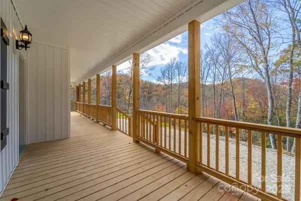 a view of a balcony with wooden floor