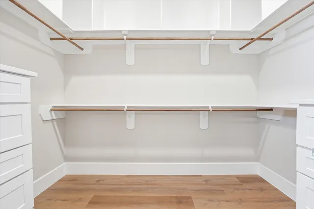 a view of an empty walk in closet